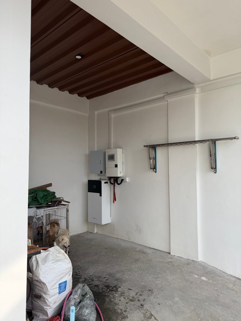 The equipment wall seen from the garage entrance, roof trusses above.